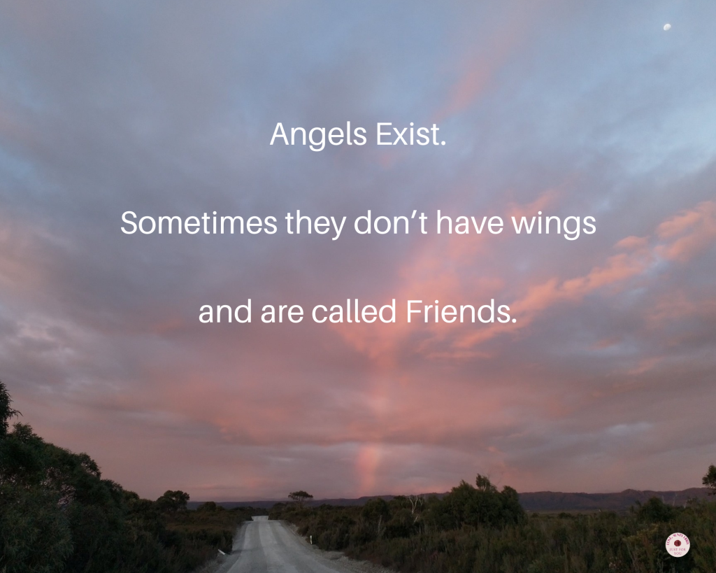 Photo of sunset and rainbow over a country road, text says: Angels Exist. Sometimes they don't have wings and are called friends.