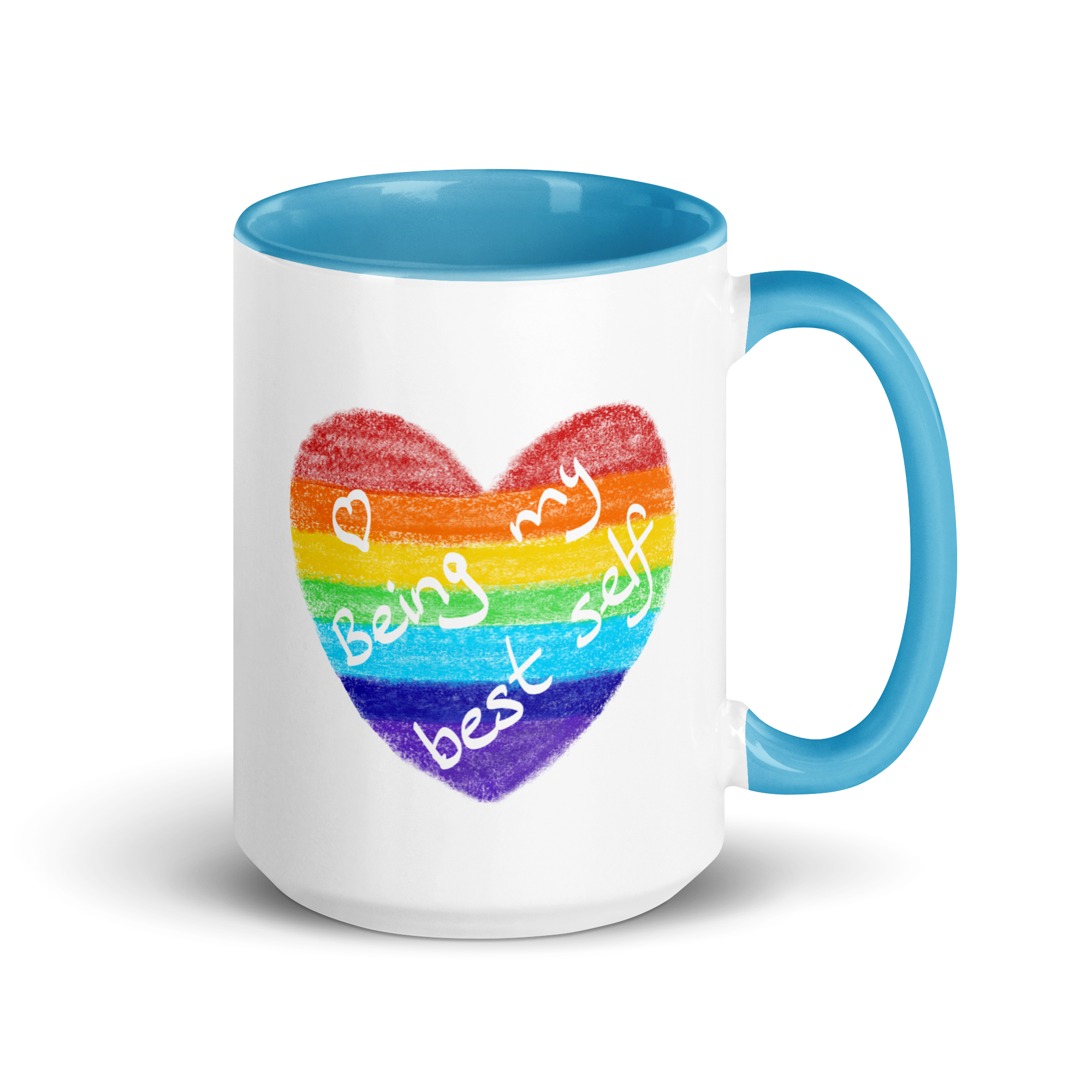White mug with blue inside and blue handle. Printed crayon rainbow heart with white text: heart Being My Best Self